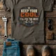 Funny HVAC Tee Shirt "Keep Your Cool. I'll Fix The Rest." T-Shirt – Vintage GraphicTee — army — Flat-lay Funny HVAC Tee Shirt "Keep Your Cool. I'll Fix The Rest." T-Shirt – Vintage GraphicTee — army t-shirt, flat-lay product photo | Pressure Tested Co