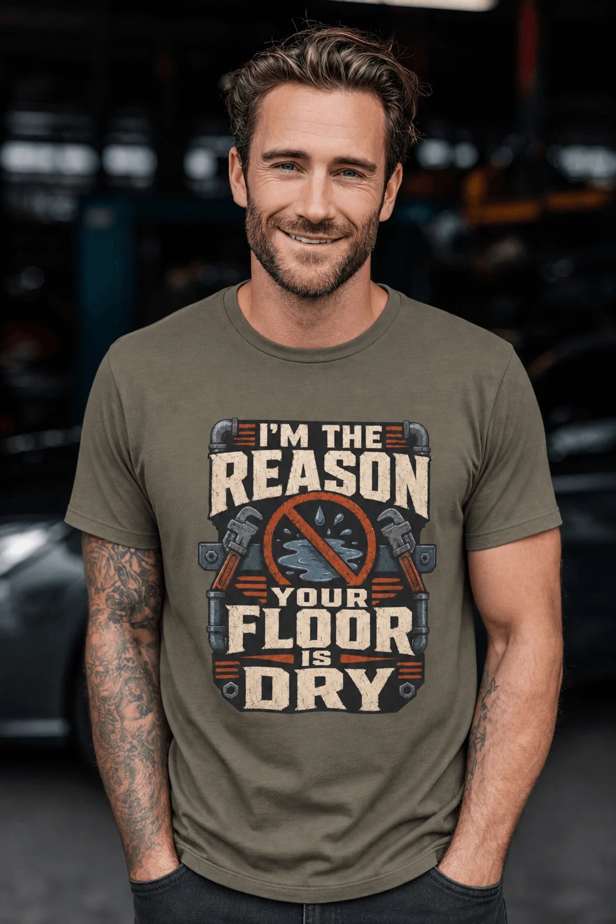 Plumber T‑Shirt – "I'm the Reason Your Floor Is Dry" Vintage Plumbing Tee — army — Model Plumber T‑Shirt – "I'm the Reason Your Floor Is Dry" Vintage Plumbing Tee — army t-shirt, model photo | Pressure Tested Co