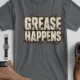 Grease Happens T-Shirt — Funny Mechanic Garage Tee — asphalt — Flat-lay Grease Happens T-Shirt — Funny Mechanic Garage Tee — asphalt t-shirt, flat-lay product photo | Pressure Tested Co