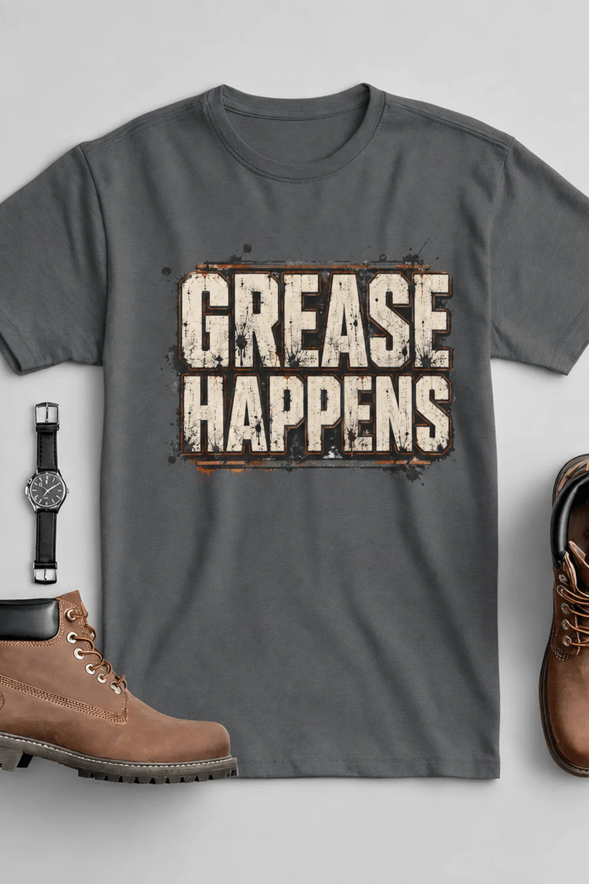 Grease Happens T-Shirt — Funny Mechanic Garage Tee — asphalt — Flat-lay Grease Happens T-Shirt — Funny Mechanic Garage Tee — asphalt t-shirt, flat-lay product photo | Pressure Tested Co