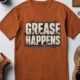 Grease Happens T-Shirt — Funny Mechanic Garage Tee — autumn — Flat-lay Grease Happens T-Shirt — Funny Mechanic Garage Tee — autumn t-shirt, flat-lay product photo | Pressure Tested Co