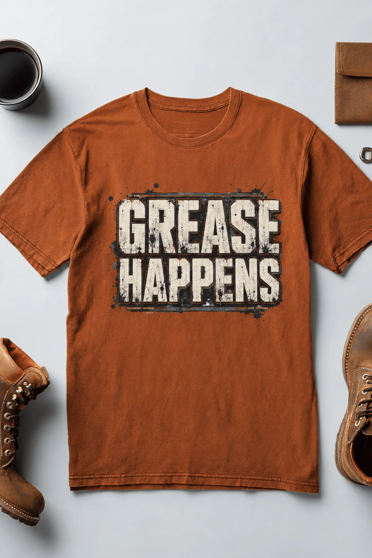 Grease Happens T-Shirt — Funny Mechanic Garage Tee — autumn — Flat-lay Grease Happens T-Shirt — Funny Mechanic Garage Tee — autumn t-shirt, flat-lay product photo | Pressure Tested Co
