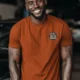 I Fix What You Ignored T-Shirt — Mechanic Wrench Tool Shirt for Technicians & DIYers — autumn — Model I Fix What You Ignored T-Shirt — Mechanic Wrench Tool Shirt for Technicians & DIYers — autumn t-shirt, model photo | Pressure Tested Co