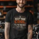 Funny HVAC Tee Shirt "Keep Your Cool. I'll Fix The Rest." T-Shirt – Vintage GraphicTee — black — Model Funny HVAC Tee Shirt "Keep Your Cool. I'll Fix The Rest." T-Shirt – Vintage GraphicTee — black t-shirt, model photo | Pressure Tested Co