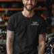 Funny Plumber Repair Graphic Tee "I Solve Problems You Can Smell" Back - "Plumbing Systems Diagnostician" Front — black — Model Funny Plumber Repair Graphic Tee "I Solve Problems You Can Smell" Back - "Plumbing Systems Diagnostician" Front — black t-shirt, model photo | Pressure Tested Co