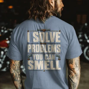 Funny Plumber Repair Graphic Tee "I Solve Problems You Can Smell" Back - "Plumbing Systems Diagnostician" Front — blue-jean t-shirt, model photo | Pressure Tested Co