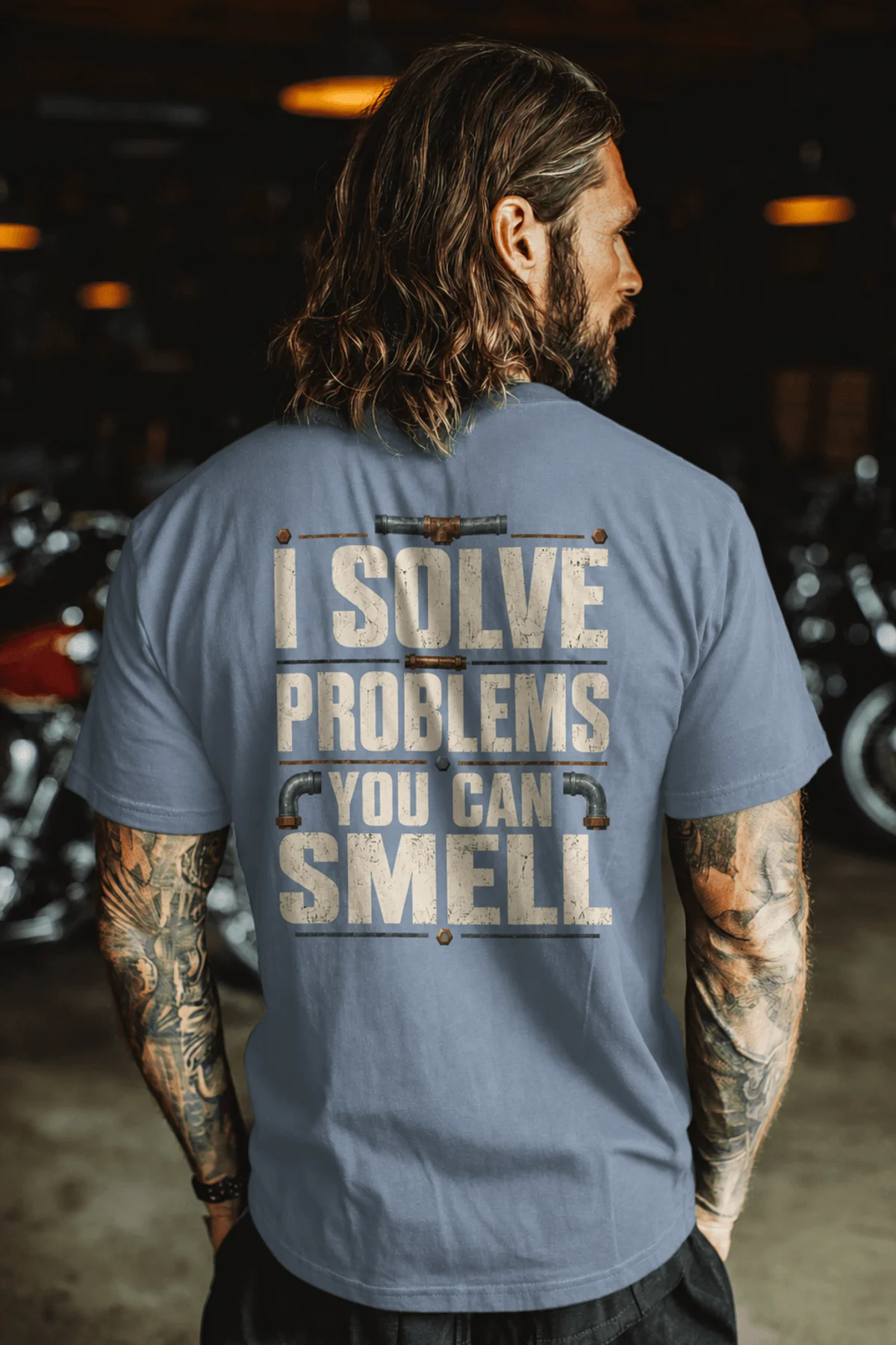 Funny Plumber Repair Graphic Tee "I Solve Problems You Can Smell" Back - "Plumbing Systems Diagnostician" Front — blue-jean — Model Funny Plumber Repair Graphic Tee "I Solve Problems You Can Smell" Back - "Plumbing Systems Diagnostician" Front — blue-jean t-shirt, model photo | Pressure Tested Co