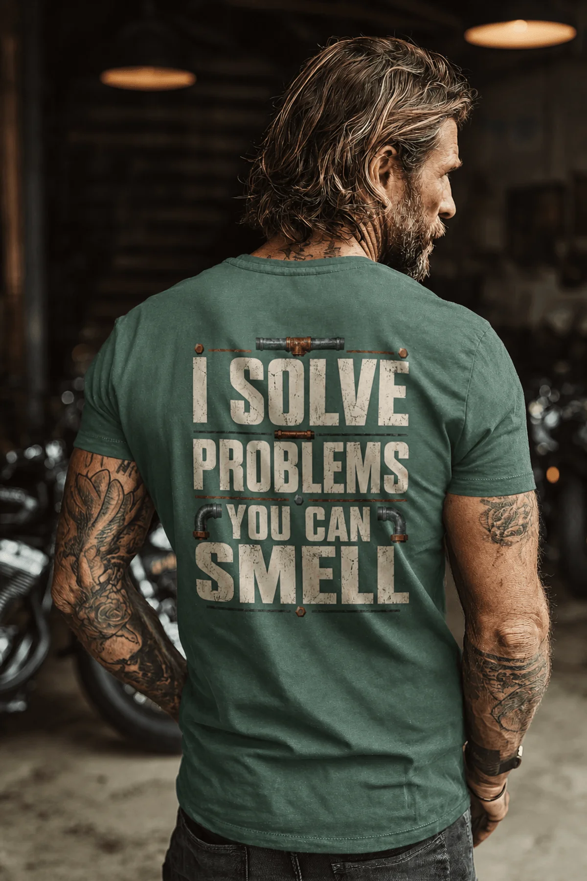 Funny Plumber Repair Graphic Tee "I Solve Problems You Can Smell" Back - "Plumbing Systems Diagnostician" Front — blue-spruce — Model Funny Plumber Repair Graphic Tee "I Solve Problems You Can Smell" Back - "Plumbing Systems Diagnostician" Front — blue-spruce t-shirt, model photo | Pressure Tested Co