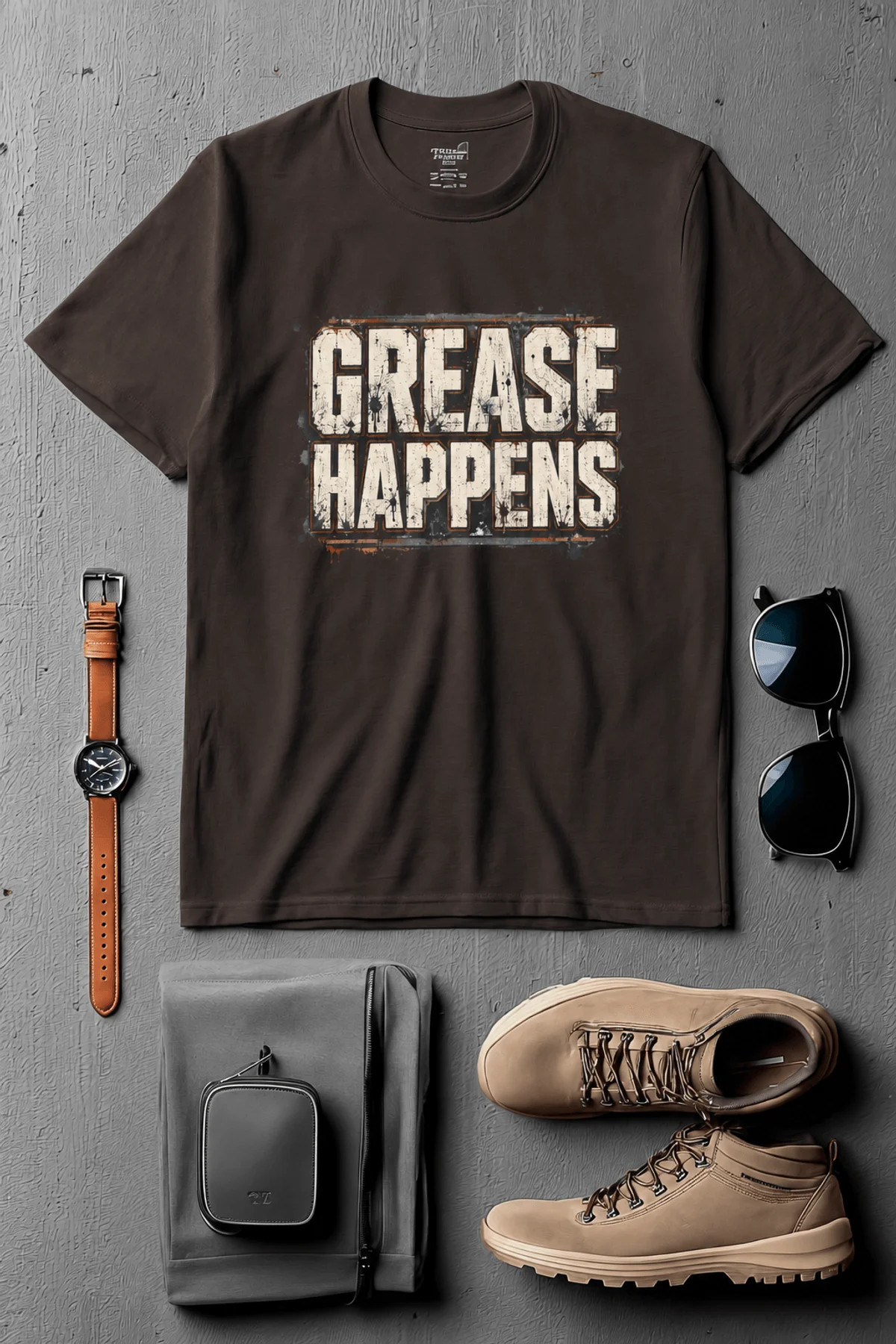 Grease Happens T-Shirt — Funny Mechanic Garage Tee — brown — Flat-lay Grease Happens T-Shirt — Funny Mechanic Garage Tee — brown t-shirt, flat-lay product photo | Pressure Tested Co