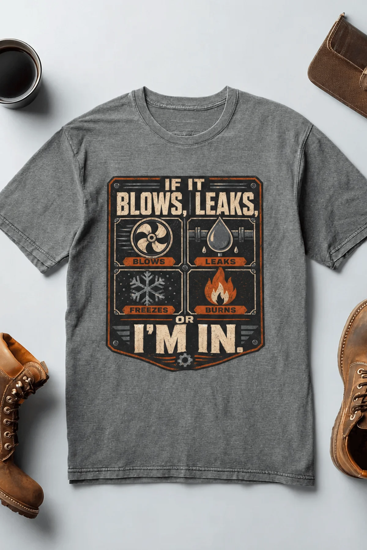 HVAC Technician T‑Shirt — "If It Blows, Leaks, Freezes or Burns I'm In" Retro Tradesmen Tee — deep-heather — Flat-lay HVAC Technician T‑Shirt — "If It Blows, Leaks, Freezes or Burns I'm In" Retro Tradesmen Tee — deep-heather t-shirt, flat-lay product photo | Pressure Tested Co