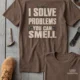 Funny Plumber Repair Graphic Tee "I Solve Problems You Can Smell" Back - "Plumbing Systems Diagnostician" Front — espresso — Flat-lay Funny Plumber Repair Graphic Tee "I Solve Problems You Can Smell" Back - "Plumbing Systems Diagnostician" Front — espresso t-shirt, flat-lay product photo | Pressure Tested Co