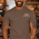 Funny Plumber Repair Graphic Tee "I Solve Problems You Can Smell" Back - "Plumbing Systems Diagnostician" Front — espresso — Model Funny Plumber Repair Graphic Tee "I Solve Problems You Can Smell" Back - "Plumbing Systems Diagnostician" Front — espresso t-shirt, model photo | Pressure Tested Co