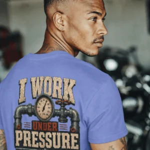 Funny Plumber Repair Graphic Tee "I Work Under Pressure" Back - "Plumbing Systems Diagnostician" Front — flo-blue t-shirt, model photo | Pressure Tested Co