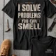 Funny Plumber Repair Graphic Tee "I Solve Problems You Can Smell" Back - "Plumbing Systems Diagnostician" Front — graphite — Flat-lay Funny Plumber Repair Graphic Tee "I Solve Problems You Can Smell" Back - "Plumbing Systems Diagnostician" Front — graphite t-shirt, flat-lay product photo | Pressure Tested Co