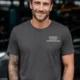 Funny Plumber Repair Graphic Tee "I Work Under Pressure" Back - "Plumbing Systems Diagnostician" Front — graphite t-shirt, model photo | Pressure Tested Co