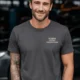 Funny Plumber Repair Graphic Tee "I Solve Problems You Can Smell" Back - "Plumbing Systems Diagnostician" Front — graphite — Model Funny Plumber Repair Graphic Tee "I Solve Problems You Can Smell" Back - "Plumbing Systems Diagnostician" Front — graphite t-shirt, model photo | Pressure Tested Co