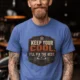 Funny HVAC Tee Shirt "Keep Your Cool. I'll Fix The Rest." T-Shirt – Vintage GraphicTee — heather-columbia-blue — Model Funny HVAC Tee Shirt "Keep Your Cool. I'll Fix The Rest." T-Shirt – Vintage GraphicTee — heather-columbia-blue t-shirt, model photo | Pressure Tested Co