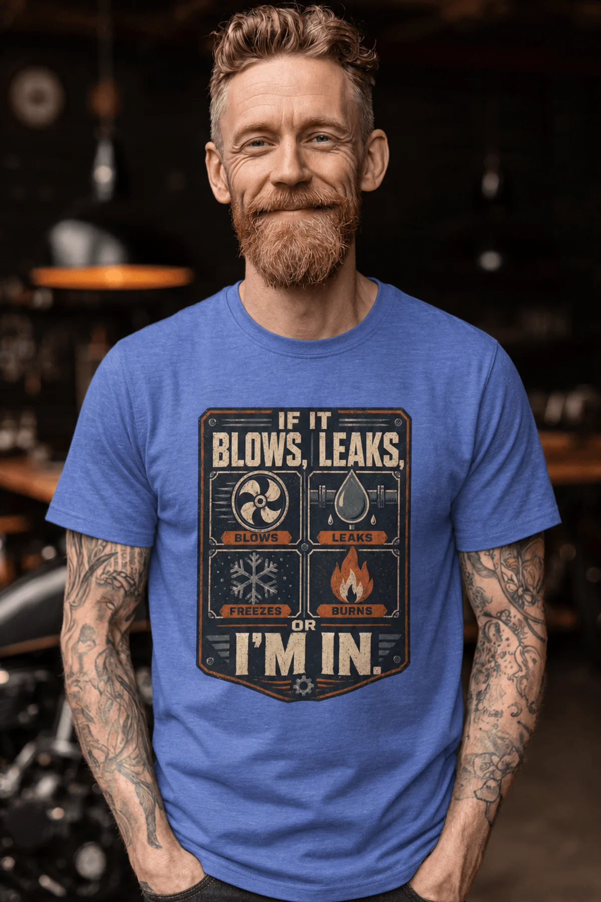 HVAC Technician T‑Shirt — "If It Blows, Leaks, Freezes or Burns I'm In" Retro Tradesmen Tee — heather-columbia-blue — Model HVAC Technician T‑Shirt — "If It Blows, Leaks, Freezes or Burns I'm In" Retro Tradesmen Tee — heather-columbia-blue t-shirt, model photo | Pressure Tested Co