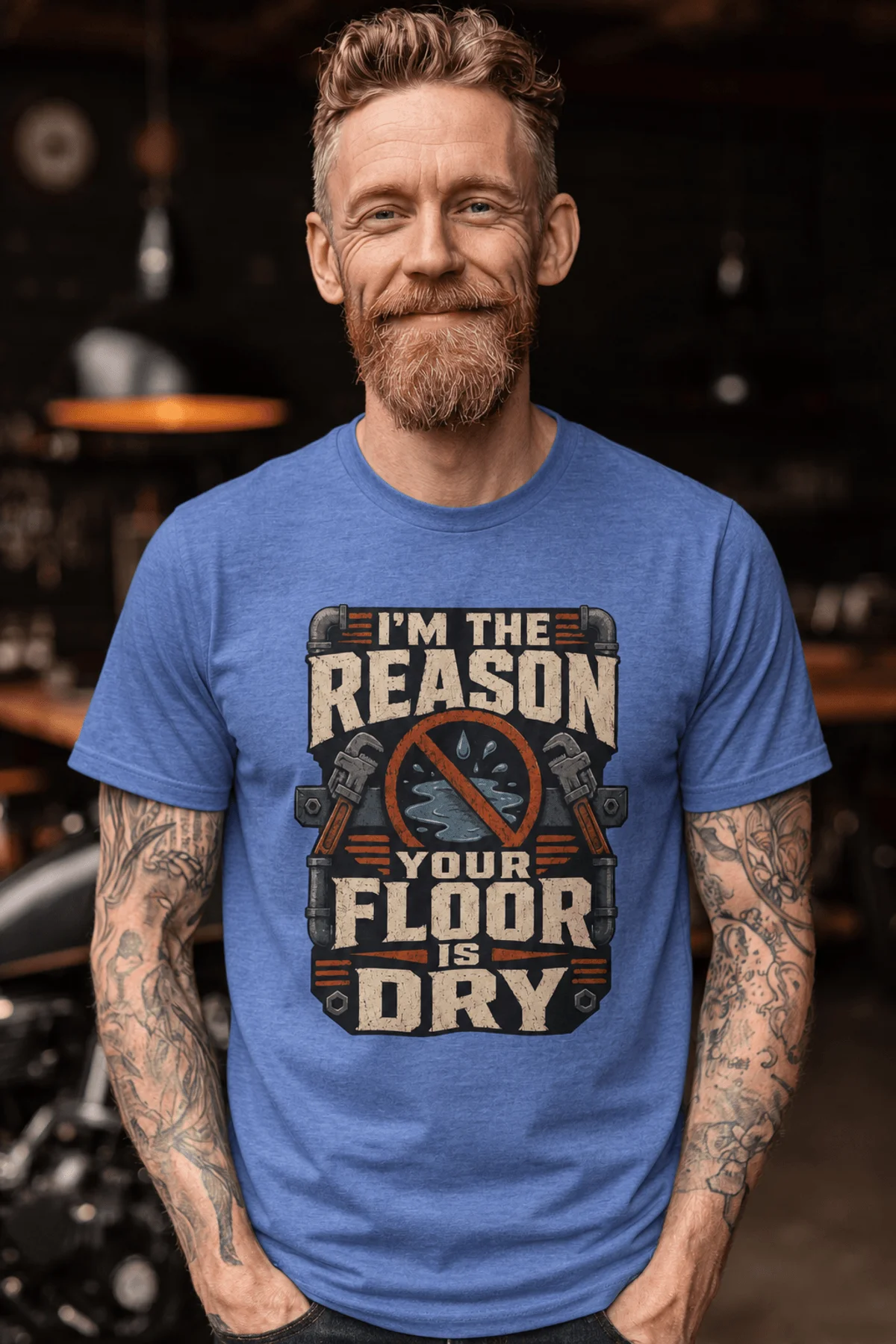 Plumber T‑Shirt – "I'm the Reason Your Floor Is Dry" Vintage Plumbing Tee — heather-columbia-blue — Model Plumber T‑Shirt – "I'm the Reason Your Floor Is Dry" Vintage Plumbing Tee — heather-columbia-blue t-shirt, model photo | Pressure Tested Co