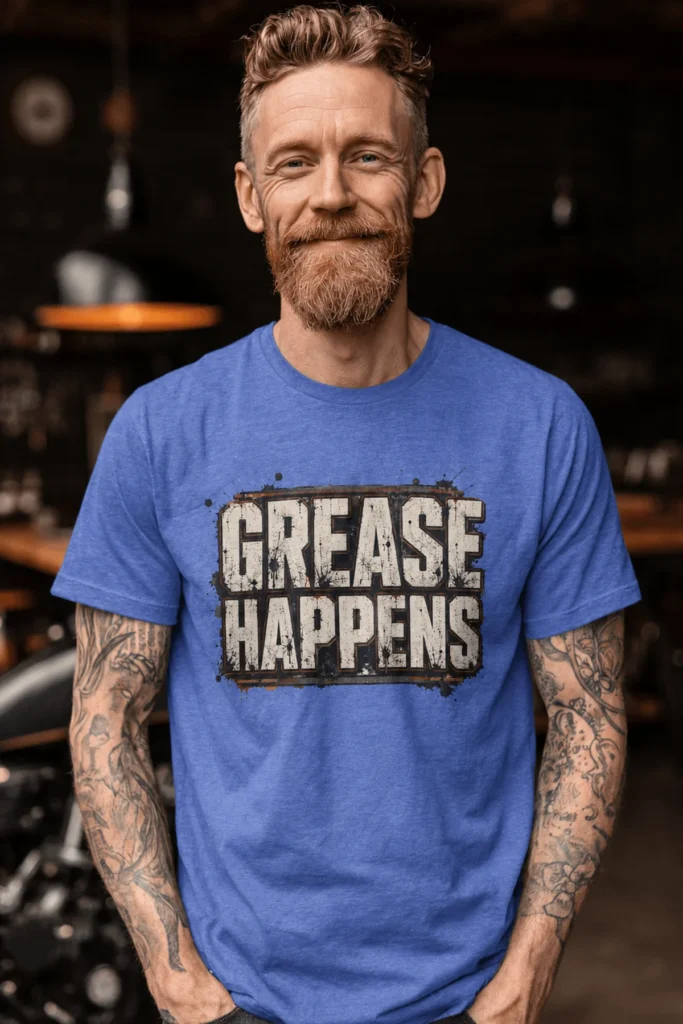 Grease Happens T-Shirt — Funny Mechanic Garage Tee — heather-columbia-blue t-shirt, model photo | Pressure Tested Co