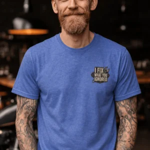 I Fix What You Ignored T-Shirt — Mechanic Wrench Tool Shirt for Technicians & DIYers — heather-columbia-blue t-shirt, model photo | Pressure Tested Co