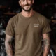 Funny Electrician Tech Tee - Back "I Make Bad Wiring Expensive" — Front "Wired For Success" Vintage Work Tee — heather-olive — Model Funny Electrician Tech Tee - Back "I Make Bad Wiring Expensive" — Front "Wired For Success" Vintage Work Tee — heather-olive t-shirt, model photo | Pressure Tested Co