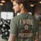 Funny Plumber Repair Graphic Tee "I Work Under Pressure" Back - "Plumbing Systems Diagnostician" Front — moss t-shirt, model photo | Pressure Tested Co