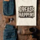 Grease Happens T-Shirt — Funny Mechanic Garage Tee — natural — Flat-lay Grease Happens T-Shirt — Funny Mechanic Garage Tee — natural t-shirt, flat-lay product photo | Pressure Tested Co