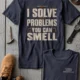 Funny Plumber Repair Graphic Tee "I Solve Problems You Can Smell" Back - "Plumbing Systems Diagnostician" Front — navy — Flat-lay Funny Plumber Repair Graphic Tee "I Solve Problems You Can Smell" Back - "Plumbing Systems Diagnostician" Front — navy t-shirt, flat-lay product photo | Pressure Tested Co