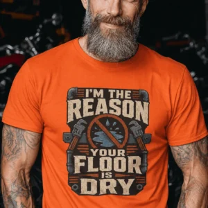 Plumber T‑Shirt – "I'm the Reason Your Floor Is Dry" Vintage Plumbing Tee — orange t-shirt, model photo | Pressure Tested Co