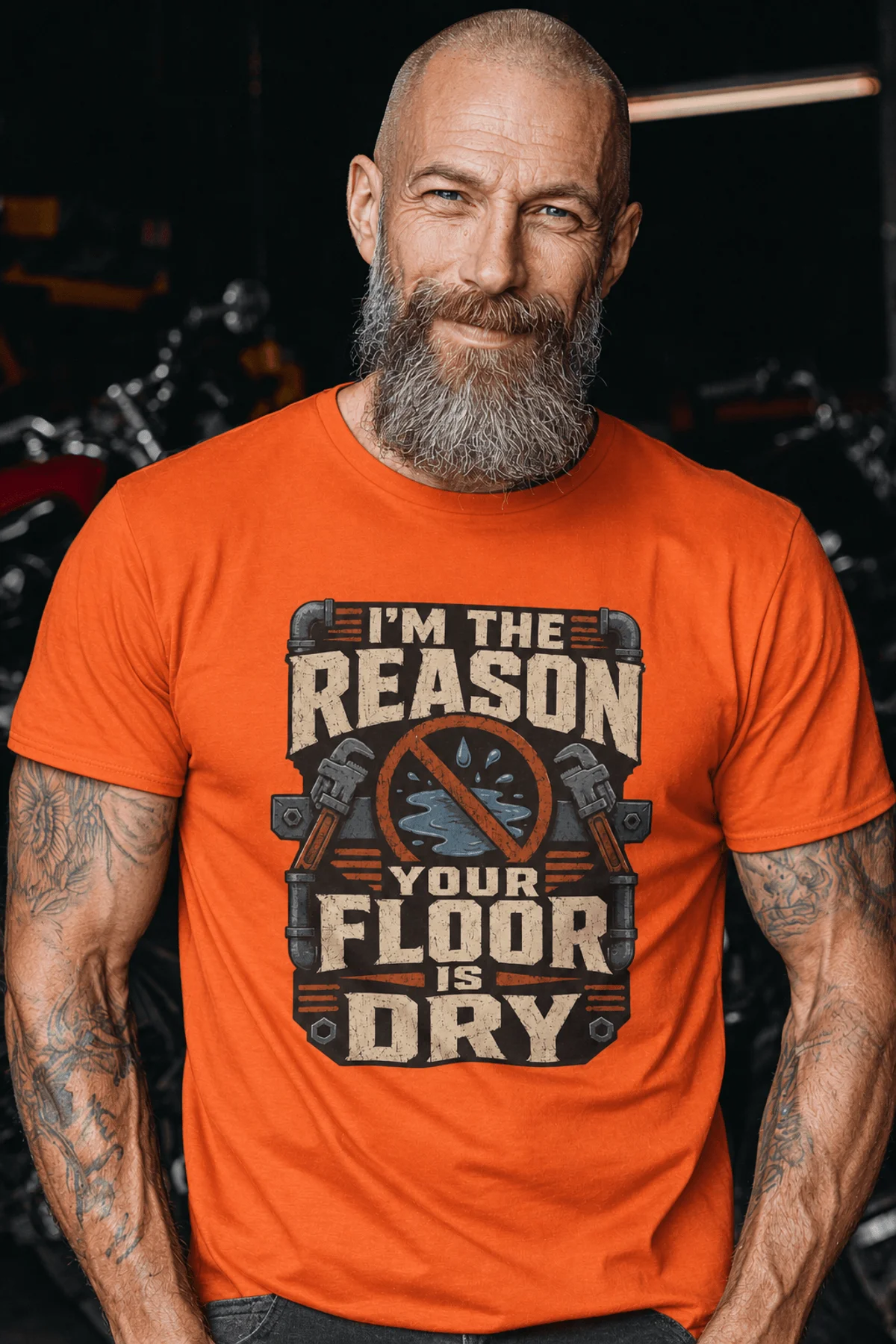 Plumber T‑Shirt – "I'm the Reason Your Floor Is Dry" Vintage Plumbing Tee — orange — Model Plumber T‑Shirt – "I'm the Reason Your Floor Is Dry" Vintage Plumbing Tee — orange t-shirt, model photo | Pressure Tested Co
