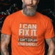Sarcastic Mechanic T‑Shirt – "I Can Fix It. I Can't Explain Your Choices" Vintage Mechanic Shirt - DIY Repair Tee — orange t-shirt, model photo | Pressure Tested Co
