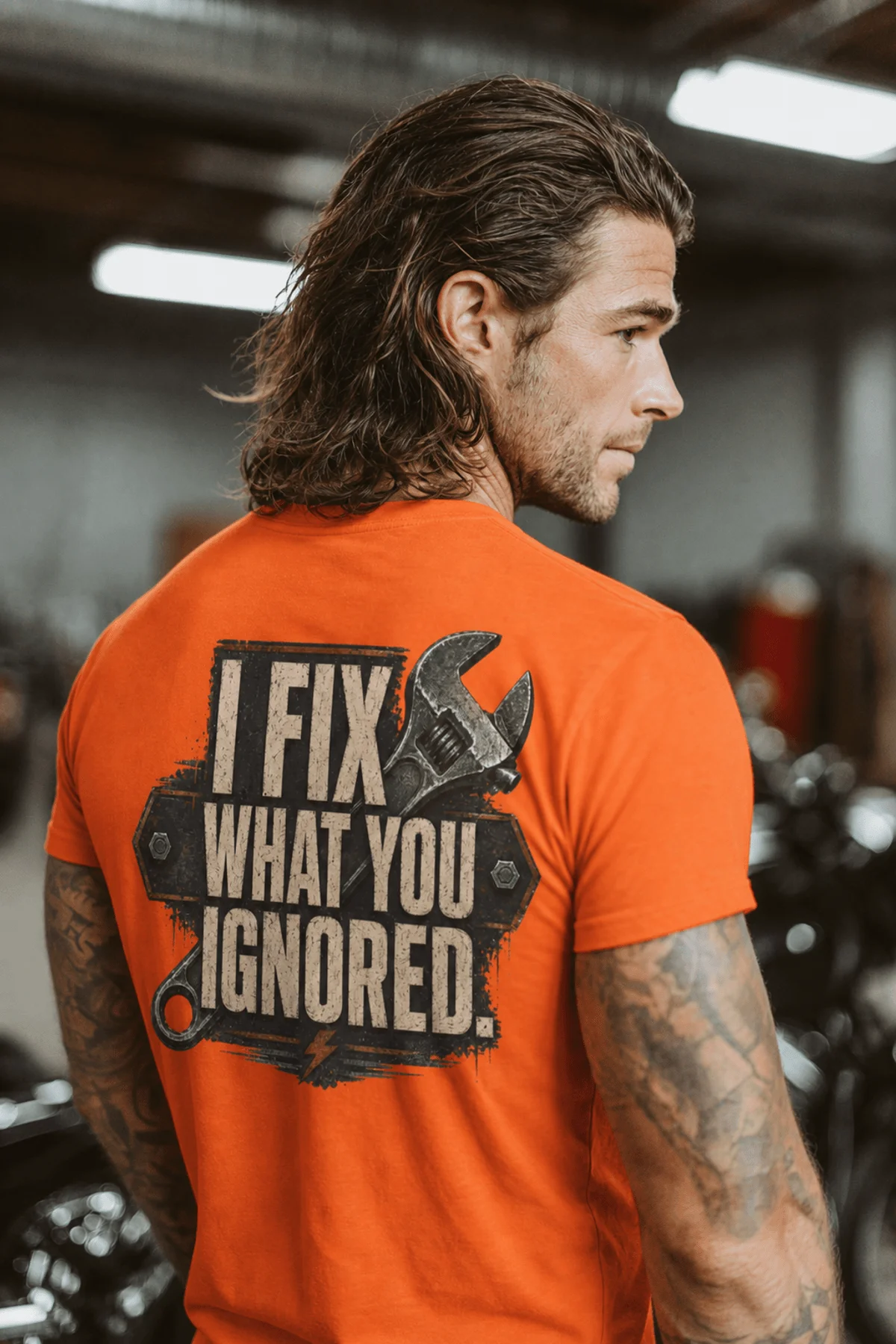 I Fix What You Ignored T-Shirt — Mechanic Wrench Tool Shirt for Technicians & DIYers — orange — Model I Fix What You Ignored T-Shirt — Mechanic Wrench Tool Shirt for Technicians & DIYers — orange t-shirt, model photo | Pressure Tested Co