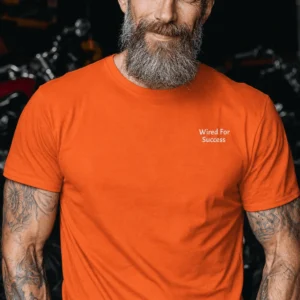 Funny Electrician Tech Tee - Back "I Make Bad Wiring Expensive" — Front "Wired For Success" Vintage Work Tee — orange t-shirt, model photo | Pressure Tested Co