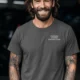 Funny Plumber Repair Graphic Tee "I Solve Problems You Can Smell" Back - "Plumbing Systems Diagnostician" Front — pepper — Model Funny Plumber Repair Graphic Tee "I Solve Problems You Can Smell" Back - "Plumbing Systems Diagnostician" Front — pepper t-shirt, model photo | Pressure Tested Co