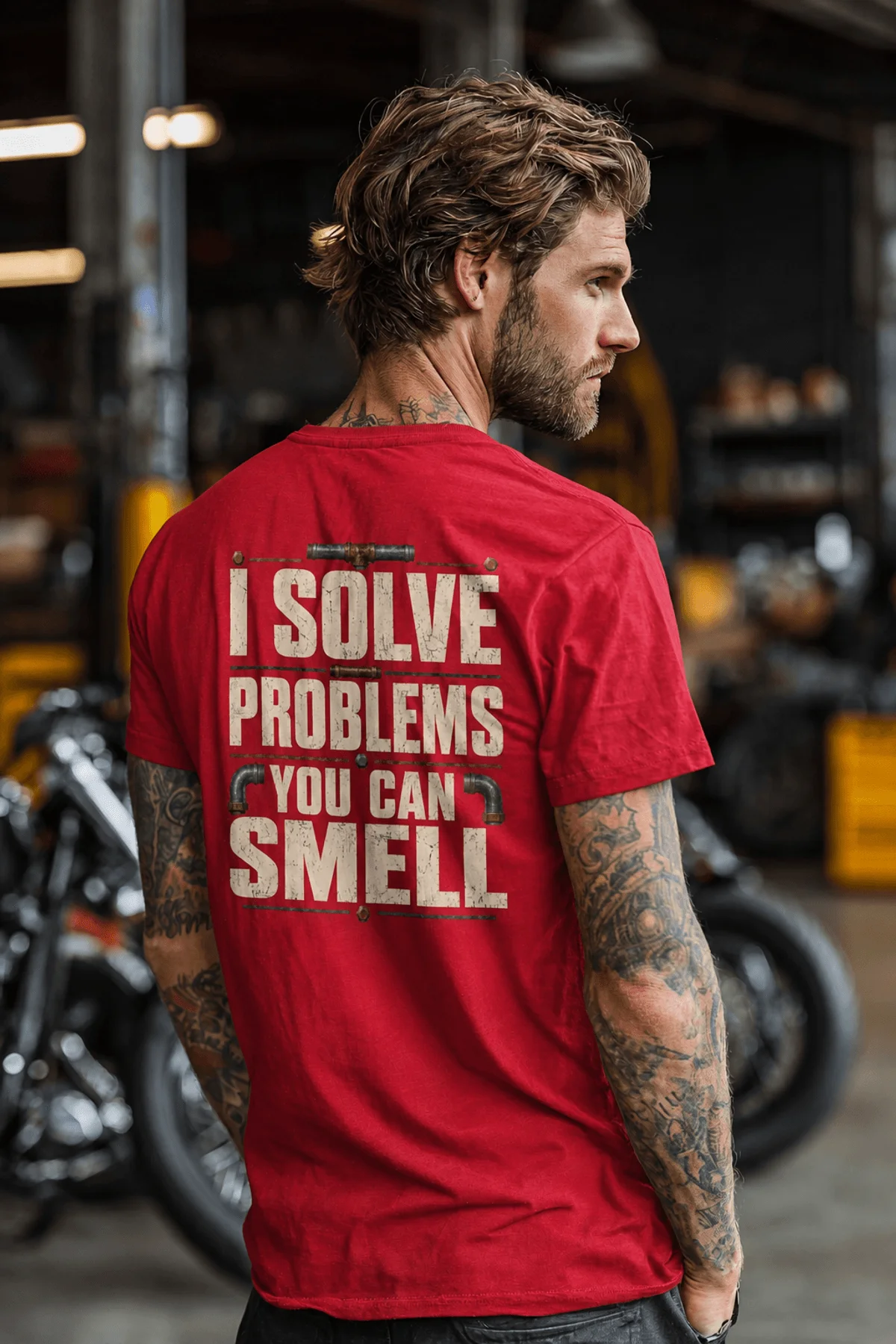 Funny Plumber Repair Graphic Tee "I Solve Problems You Can Smell" Back - "Plumbing Systems Diagnostician" Front — red — Model Funny Plumber Repair Graphic Tee "I Solve Problems You Can Smell" Back - "Plumbing Systems Diagnostician" Front — red t-shirt, model photo | Pressure Tested Co