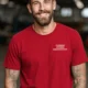 Funny Plumber Repair Graphic Tee "I Solve Problems You Can Smell" Back - "Plumbing Systems Diagnostician" Front — red — Model Funny Plumber Repair Graphic Tee "I Solve Problems You Can Smell" Back - "Plumbing Systems Diagnostician" Front — red t-shirt, model photo | Pressure Tested Co