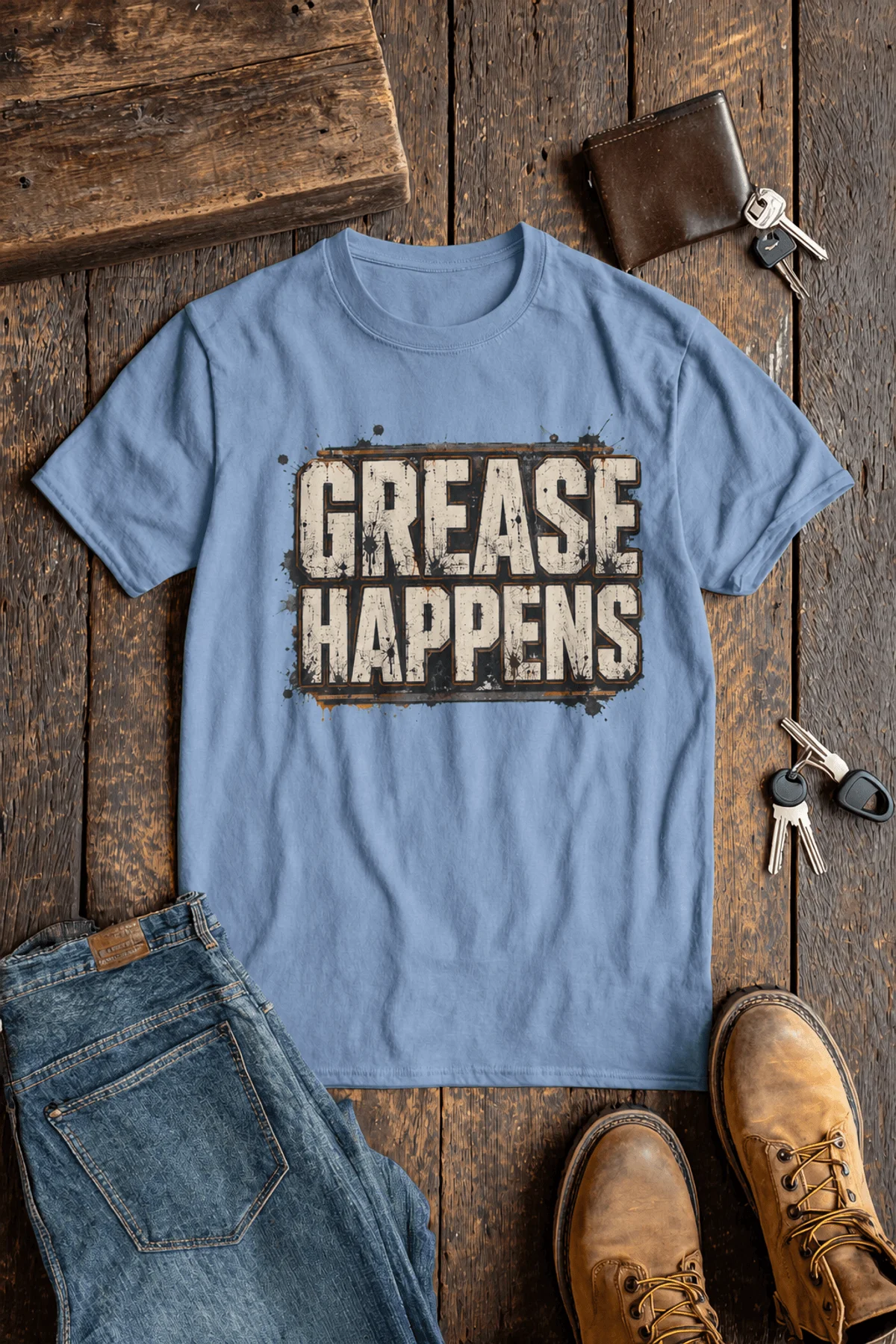 Grease Happens T-Shirt — Funny Mechanic Garage Tee — steel-blue — Flat-lay Grease Happens T-Shirt — Funny Mechanic Garage Tee — steel-blue t-shirt, flat-lay product photo | Pressure Tested Co