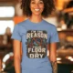 Plumber T‑Shirt – "I'm the Reason Your Floor Is Dry" Vintage Plumbing Tee — steel-blue — Model Plumber T‑Shirt – "I'm the Reason Your Floor Is Dry" Vintage Plumbing Tee — steel-blue t-shirt, model photo | Pressure Tested Co
