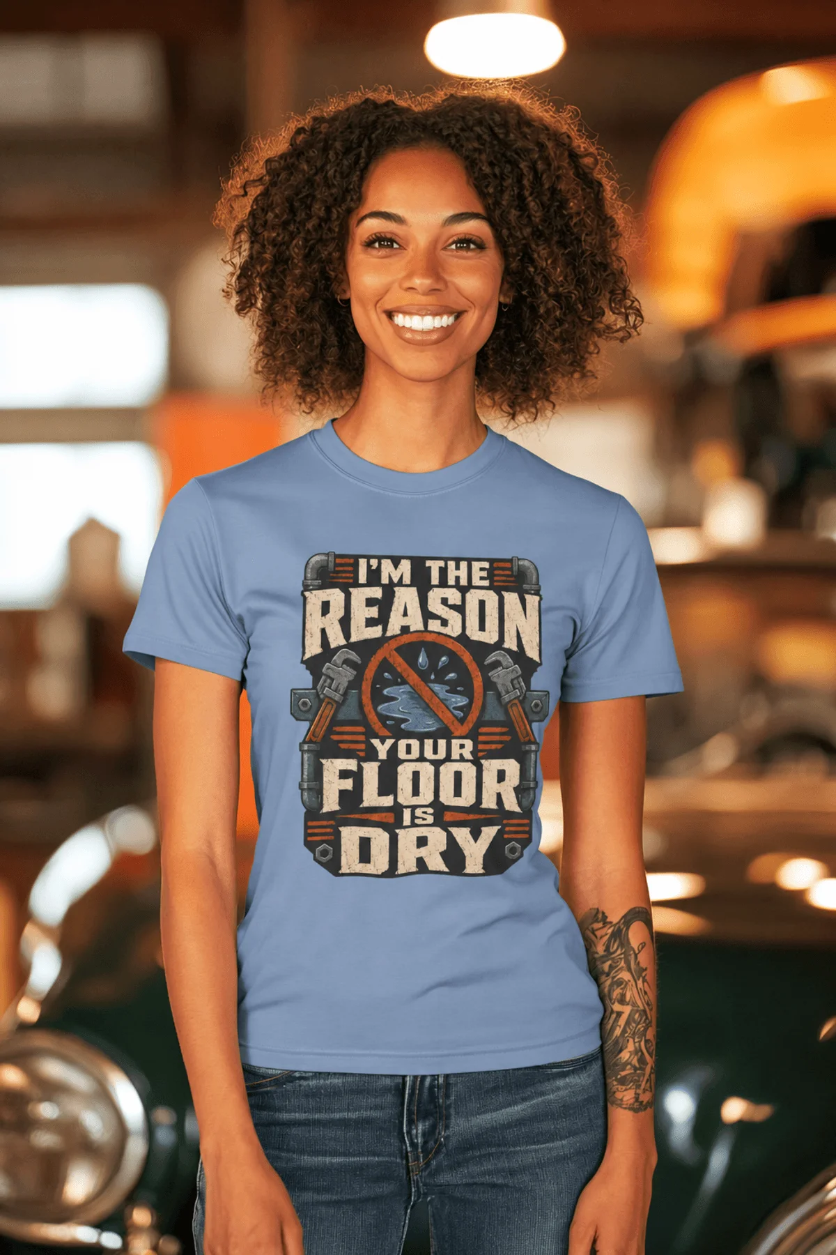 Plumber T‑Shirt – "I'm the Reason Your Floor Is Dry" Vintage Plumbing Tee — steel-blue — Model Plumber T‑Shirt – "I'm the Reason Your Floor Is Dry" Vintage Plumbing Tee — steel-blue t-shirt, model photo | Pressure Tested Co