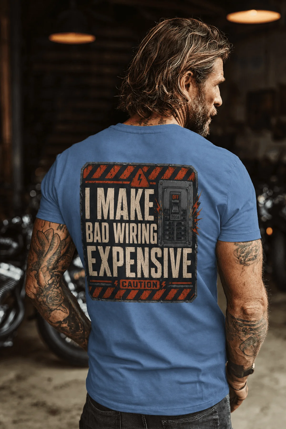 Funny Electrician Tech Tee - Back "I Make Bad Wiring Expensive" — Front "Wired For Success" Vintage Work Tee — steel-blue — Model Funny Electrician Tech Tee - Back "I Make Bad Wiring Expensive" — Front "Wired For Success" Vintage Work Tee — steel-blue t-shirt, model photo | Pressure Tested Co