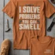 Funny Plumber Repair Graphic Tee "I Solve Problems You Can Smell" Back - "Plumbing Systems Diagnostician" Front — yam — Flat-lay Funny Plumber Repair Graphic Tee "I Solve Problems You Can Smell" Back - "Plumbing Systems Diagnostician" Front — yam t-shirt, flat-lay product photo | Pressure Tested Co