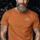Funny Plumber Repair Graphic Tee "I Solve Problems You Can Smell" Back - "Plumbing Systems Diagnostician" Front — yam — Model Funny Plumber Repair Graphic Tee "I Solve Problems You Can Smell" Back - "Plumbing Systems Diagnostician" Front — yam t-shirt, model photo | Pressure Tested Co