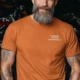 Funny Plumber Repair Graphic Tee "I Work Under Pressure" Back - "Plumbing Systems Diagnostician" Front — yam t-shirt, model photo | Pressure Tested Co