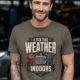 Funny HVAC Technician Tee - “I Fix The Weather Indoors.” Cooling/Furnace Shop Work Shirt — army — Model Funny HVAC Technician Tee - “I Fix The Weather Indoors.” Cooling/Furnace Shop Work Shirt — army t-shirt, model photo | Pressure Tested Co