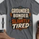 Grounded, Bonded and Slightly Tired Graphic Tee — Funny Electrical Worker Shirt — asphalt t-shirt, flat-lay product photo | Pressure Tested Co