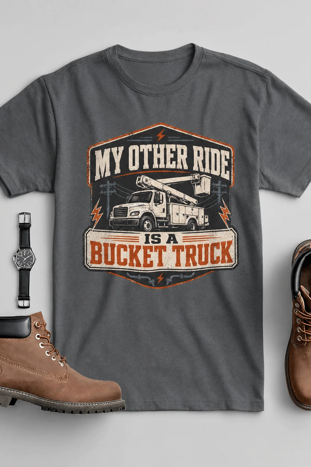 Bucket Truck T-Shirt - “My Other Ride Is A Bucket Truck” Utility Crew/Electrician Tee — asphalt t-shirt, flat-lay product photo | Pressure Tested Co
