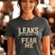 Leaks Fear Me T-Shirt - Funny Plumber Pipes Tee — asphalt t-shirt, model photo | Pressure Tested Co