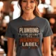 Plumbing Warning Label T-Shirt — Funny Plumber Shirt — asphalt t-shirt, model photo | Pressure Tested Co