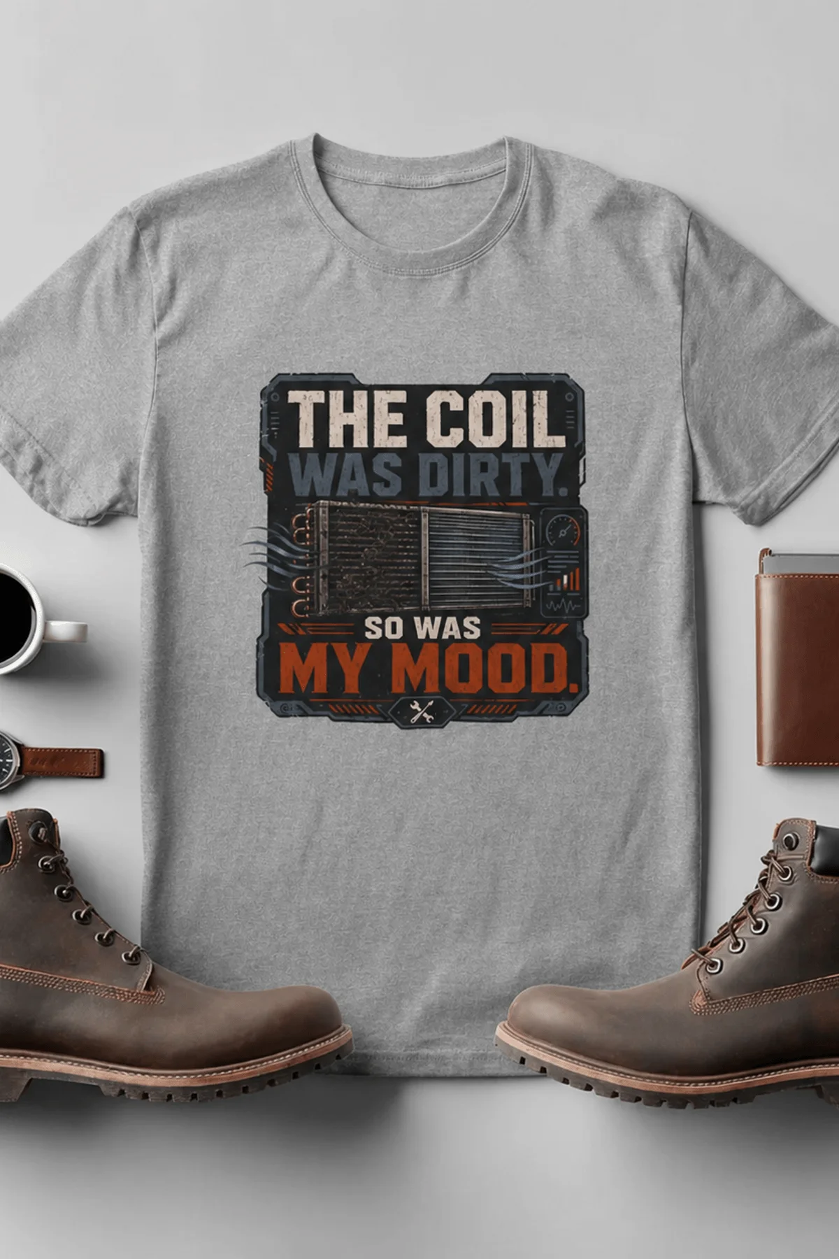 HVAC Technician Tee — “THE COIL WAS DIRTY. SO WAS MY MOOD.” — athletic-heather — Flat-lay HVAC Technician Tee — “THE COIL WAS DIRTY. SO WAS MY MOOD.” — athletic-heather t-shirt, flat-lay product photo | Pressure Tested Co